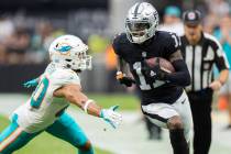 Las Vegas Raiders wide receiver Henry Ruggs III (11) breaks down the sideline past Miami Dolphi ...