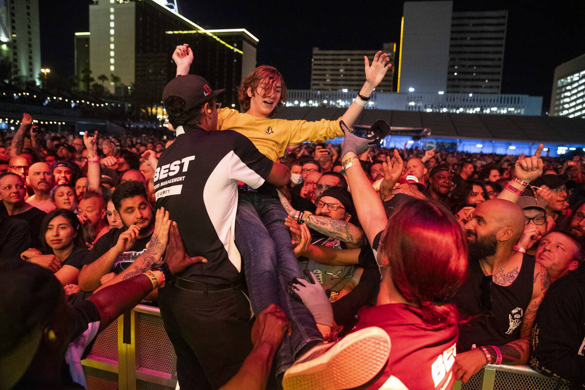 A person crowd surfs during a performance by Circle Jerks at the Punk Rock Bowling Music Festiv ...