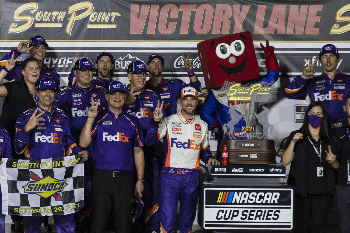 Denny Hamlin (11) celebrates with his crew after winning the 4th Annual South Point 400 at Las ...