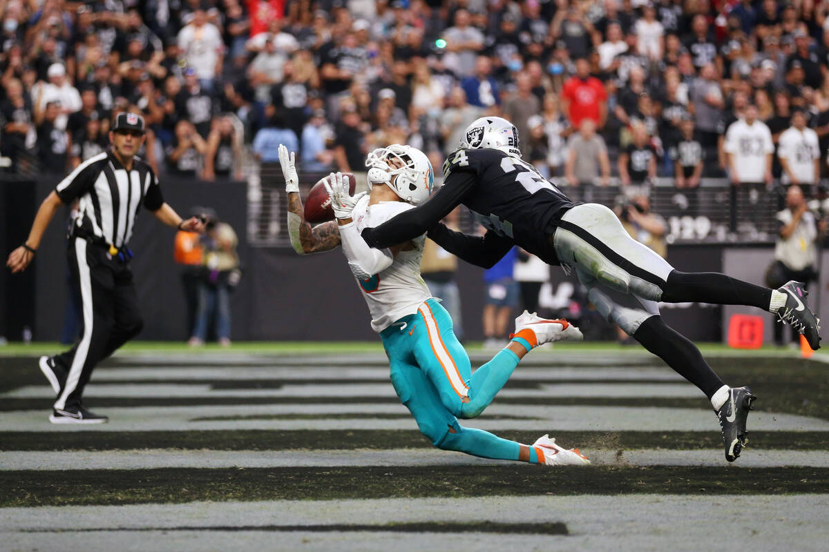 Miami Dolphins wide receiver Will Fuller (3) misses a catch under pressure from Las Vegas Raide ...