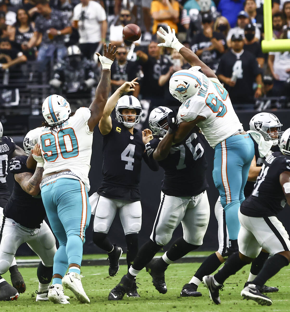 Raiders quarterback Derek Carr (4) throws a pass during the second half of NFL game against the ...
