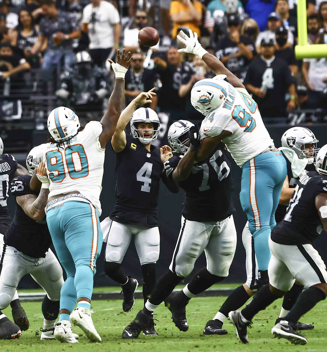 Raiders quarterback Derek Carr (4) throws a pass during the second half of NFL game against the ...