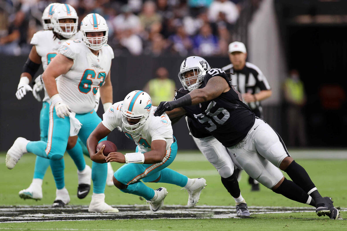 Las Vegas Raiders defensive tackle Darius Philon (96) tackles Miami Dolphins quarterback Jacoby ...