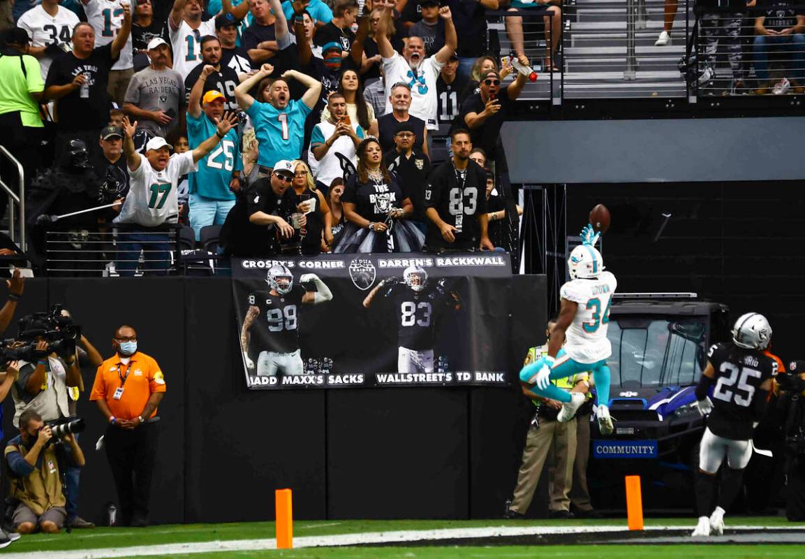 Miami Dolphins running back Malcolm Brown (34) celebrates a touchdown during the first half of ...