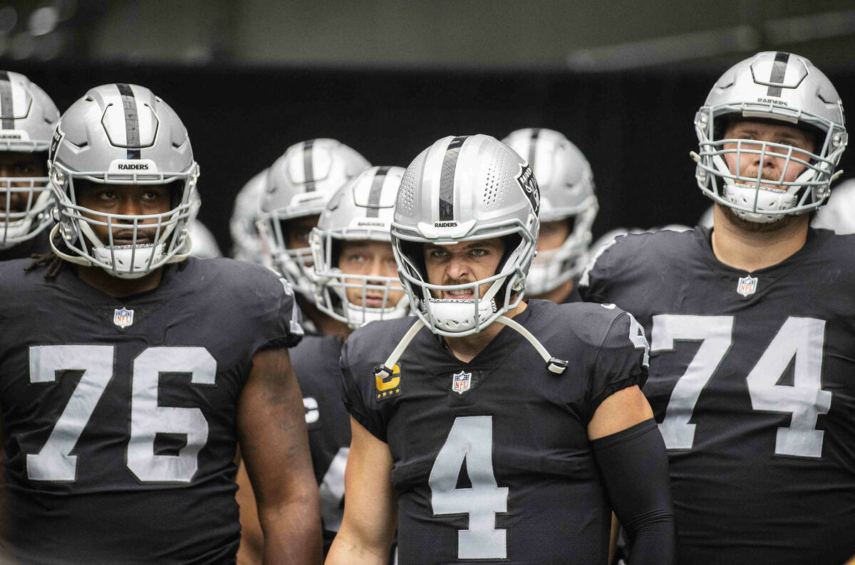 Las Vegas Raiders quarterback Derek Carr (4) gets ready to lead his team on the field before th ...