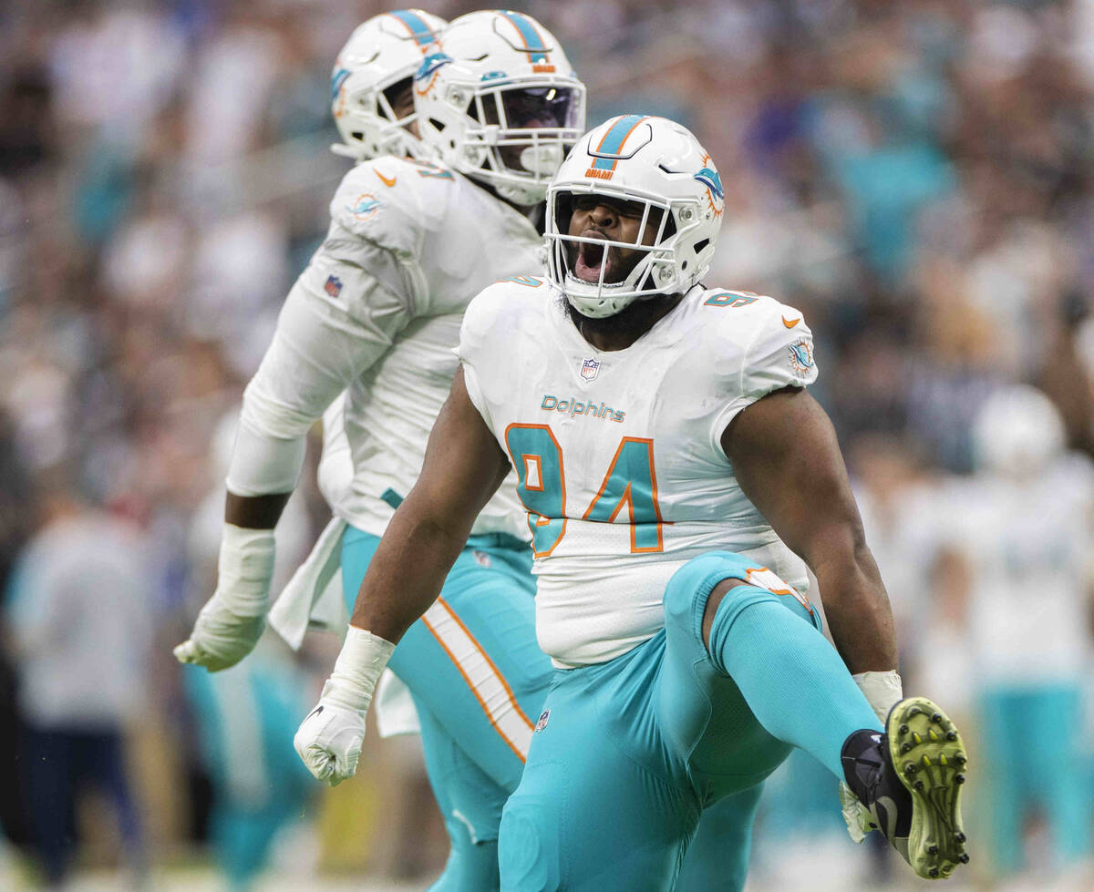 Miami Dolphins defensive end Christian Wilkins (94) celebrates a big