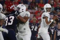 UNLV quarterback Doug Brumfield drops back to pass against Fresno State during the first half o ...