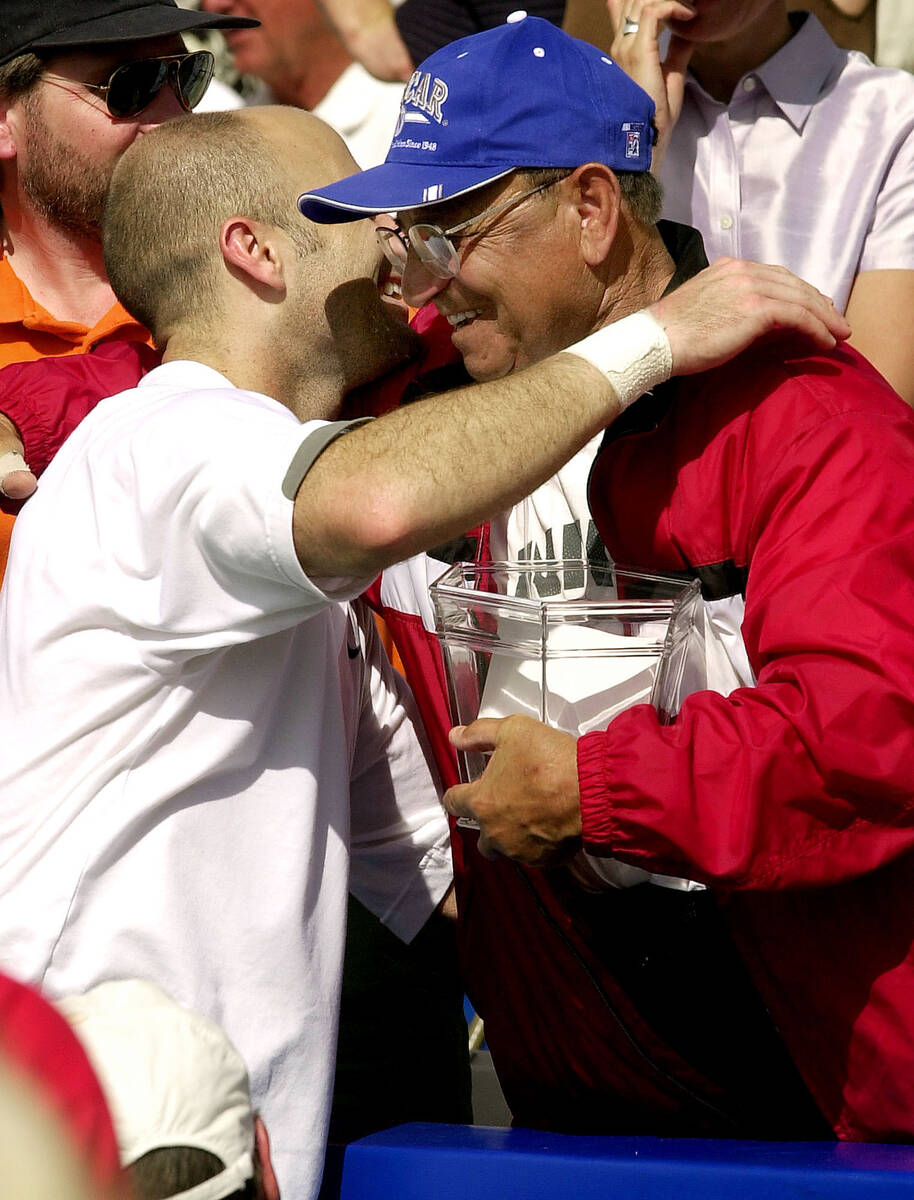 Andre Agassi hugs his dad, Mike Agassi, after defeating Juan Balcells during the final match of ...