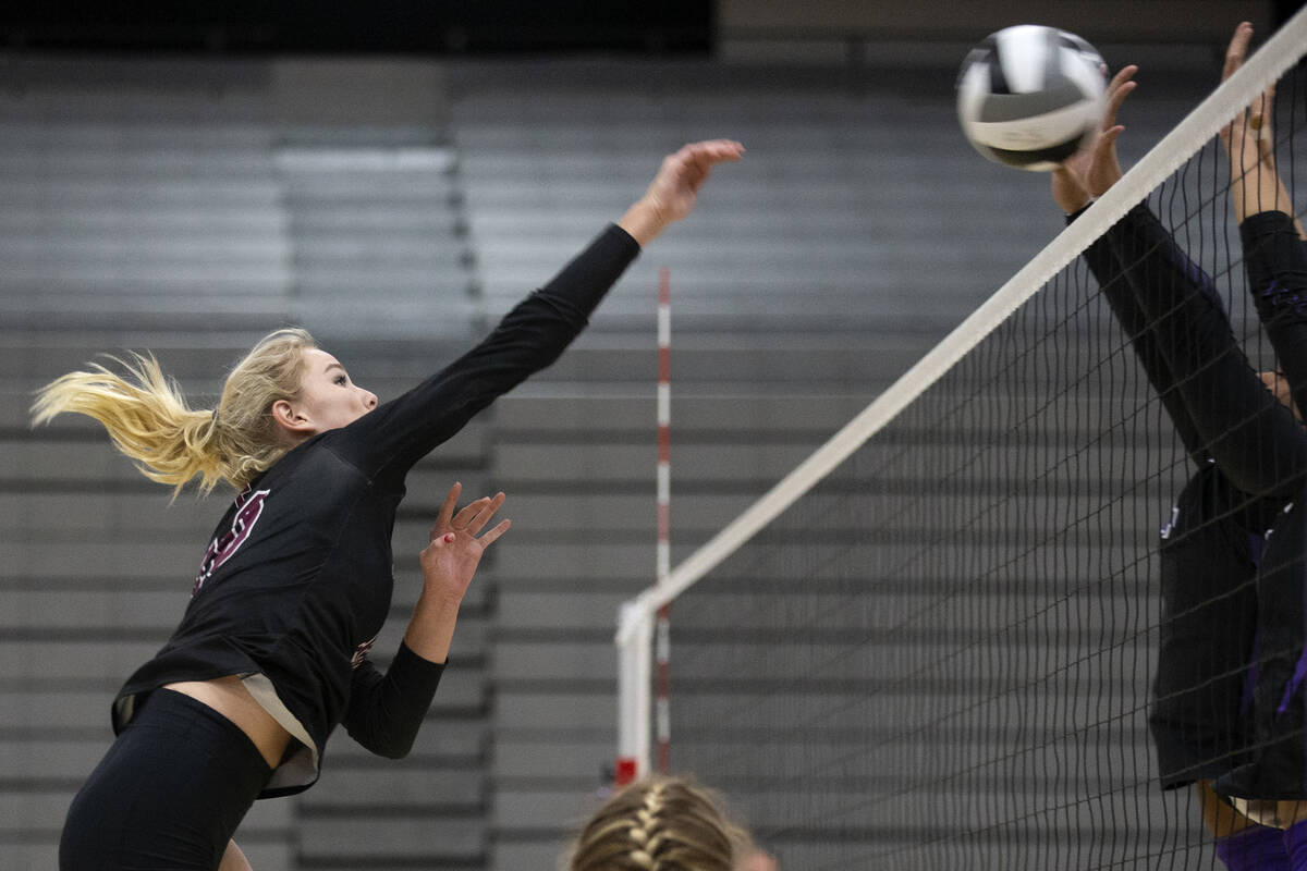 Faith Lutheran's Ella Swinn (10) spikes during a high school volleyball game against Durango at ...