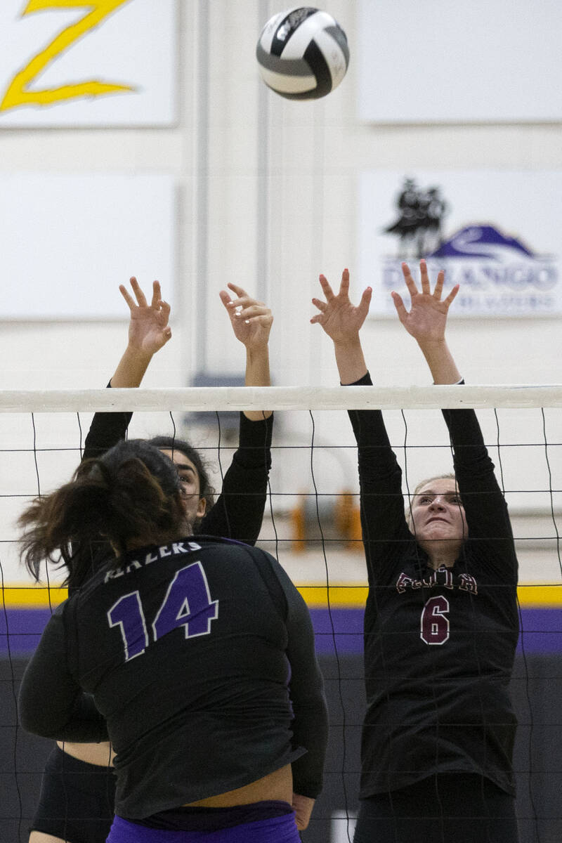 Faith Lutheran's Haylee Strong, left, and Bianca Richardson (6) miss the kill as Durango's Draz ...