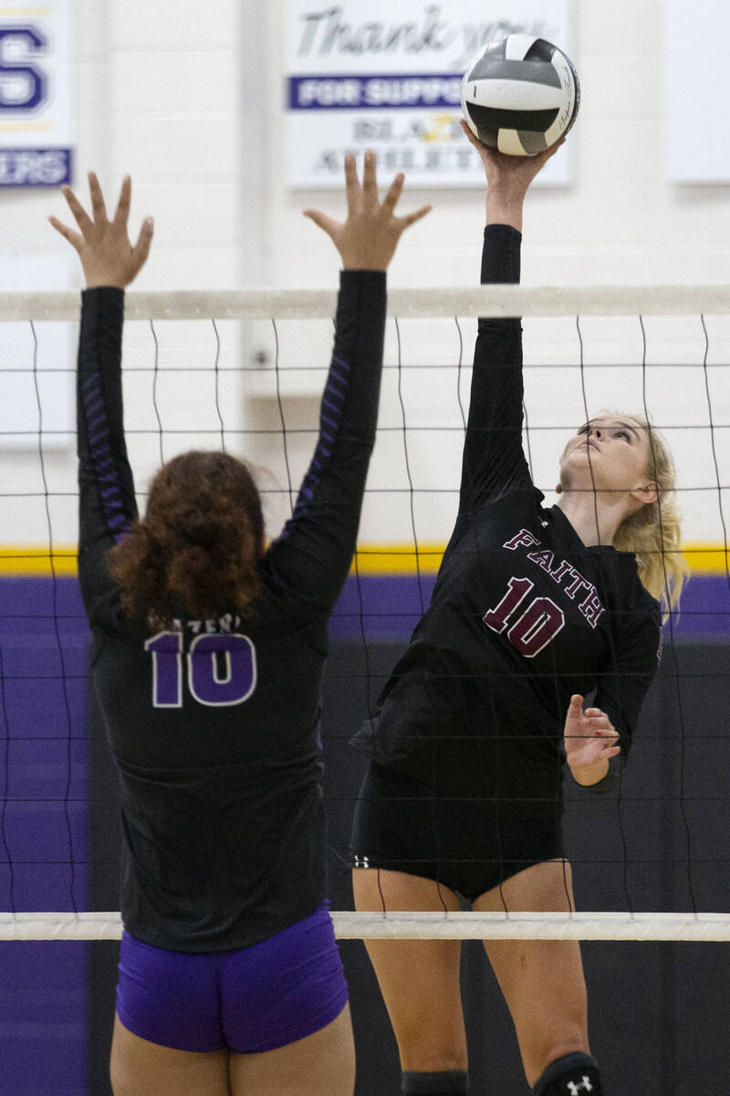 Faith Lutheran's Ella Swinn (10) spikes to Durango's Jalynn Edwards (10) during a high school v ...