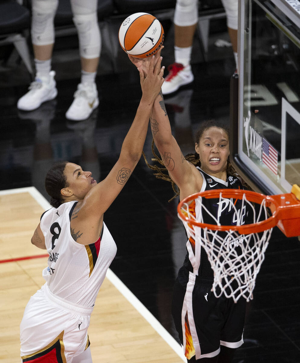 Las Vegas Aces center Liz Cambage (8) blocks a shot by Phoenix Mercury center Brittney Griner ( ...