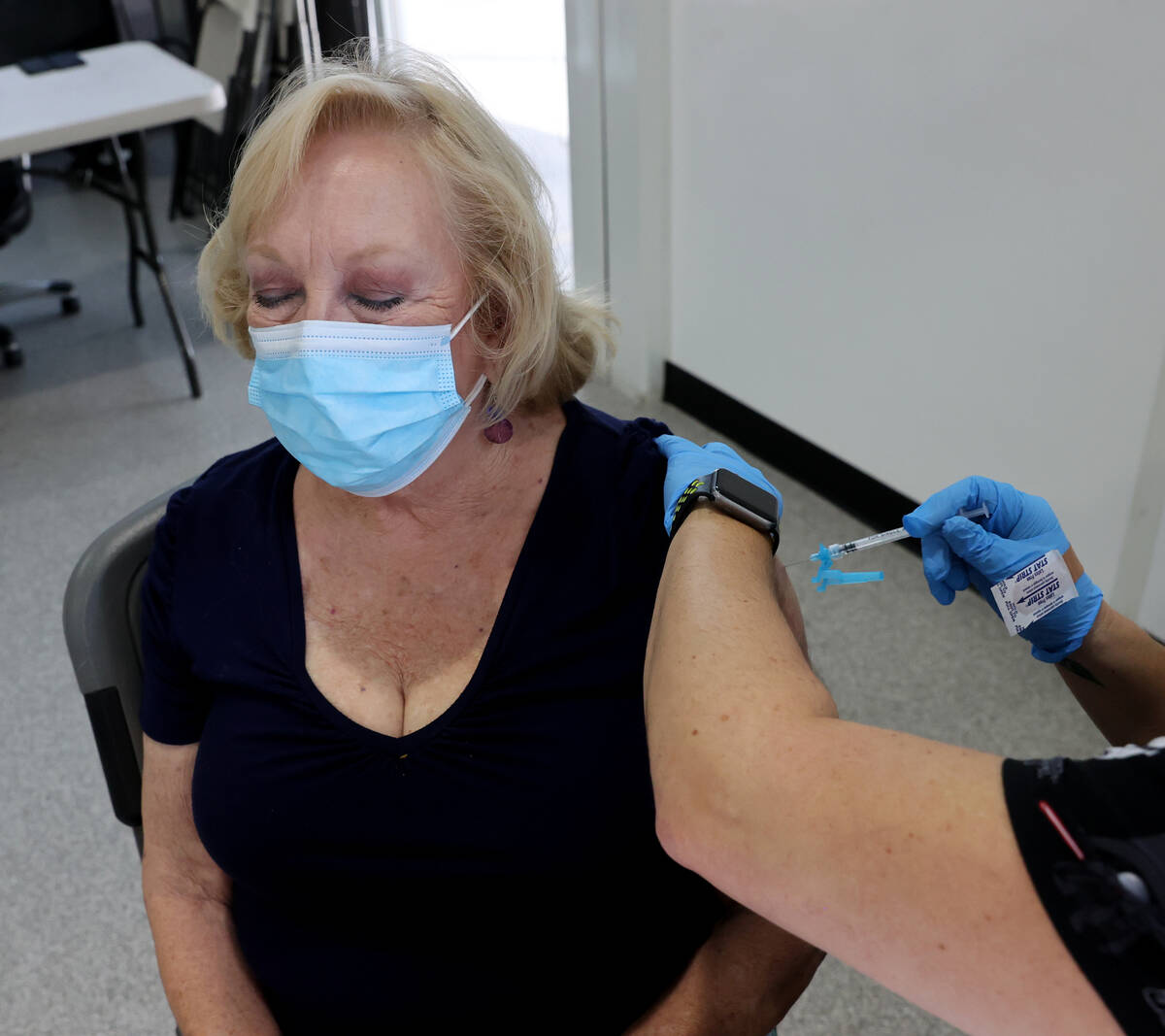 Algene Evans Wucinich of Las Vegas gets a Pfizer COVID-19 vaccine booster shot at the Southern ...