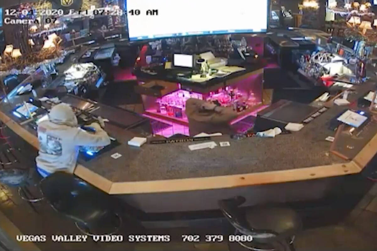 This screenshot from the surveillance video filmed on Dec. 4, 2020, shows an armed robbery at t ...