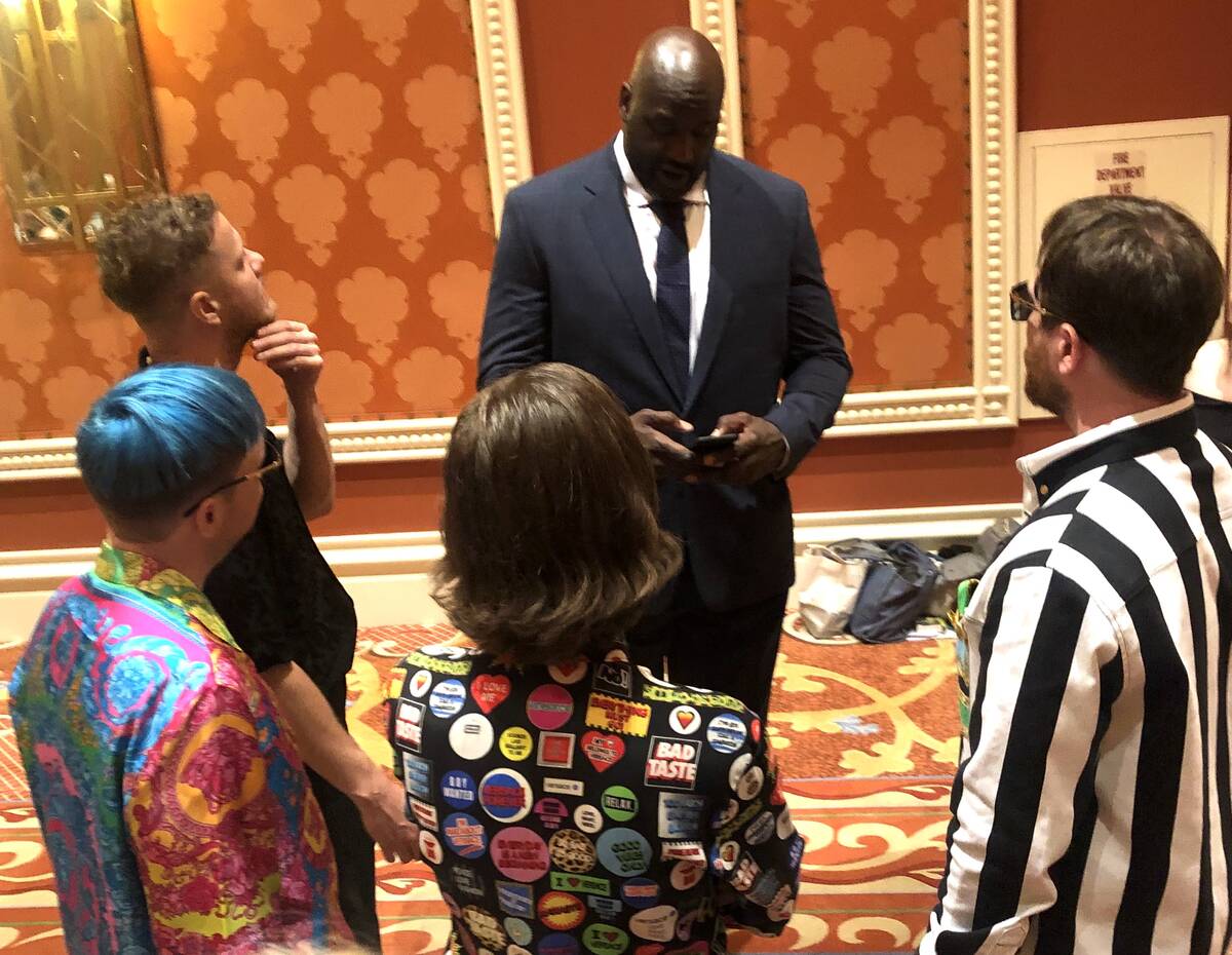 Shaquille O'Neal enters Dan Reynolds' number into his cell phone prior to the sixth annual TRF ...