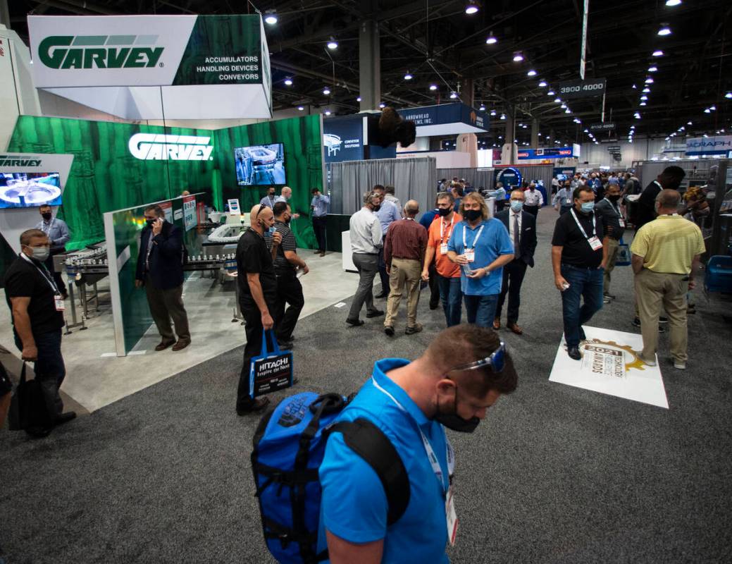 Expogoers arrive at the PACK EXPO, on Tuesday, Sep. 28, 2021, at the Las Vegas Convention Cente ...