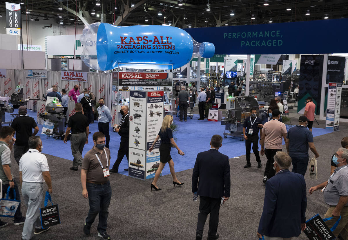 Expogoers arrive at the PACK EXPO, on Tuesday, Sep. 28, 2021, at the Las Vegas Convention Cente ...