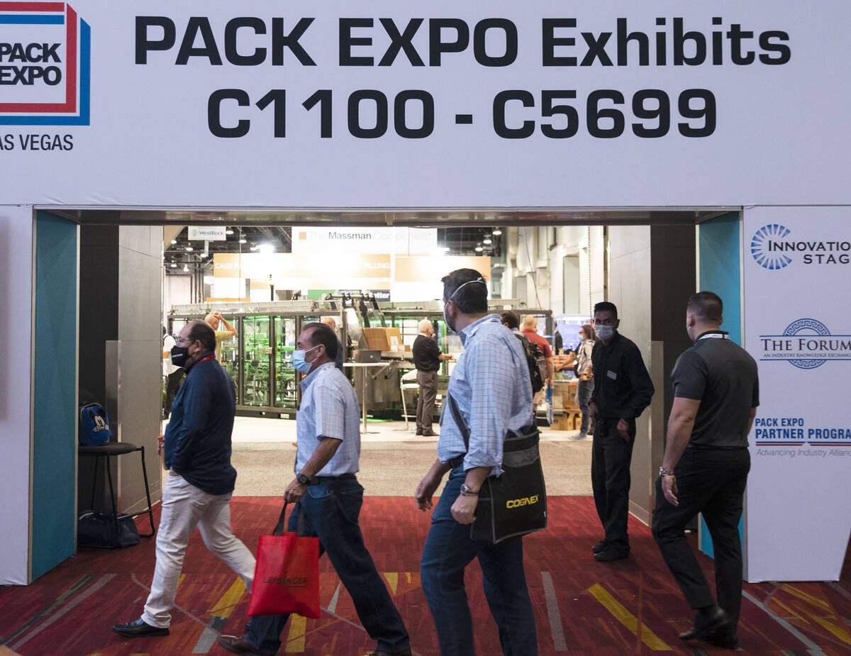 Expogoers arrive at the PACK EXPO, on Tuesday, Sep. 28, 2021, at the Las Vegas Convention Cente ...