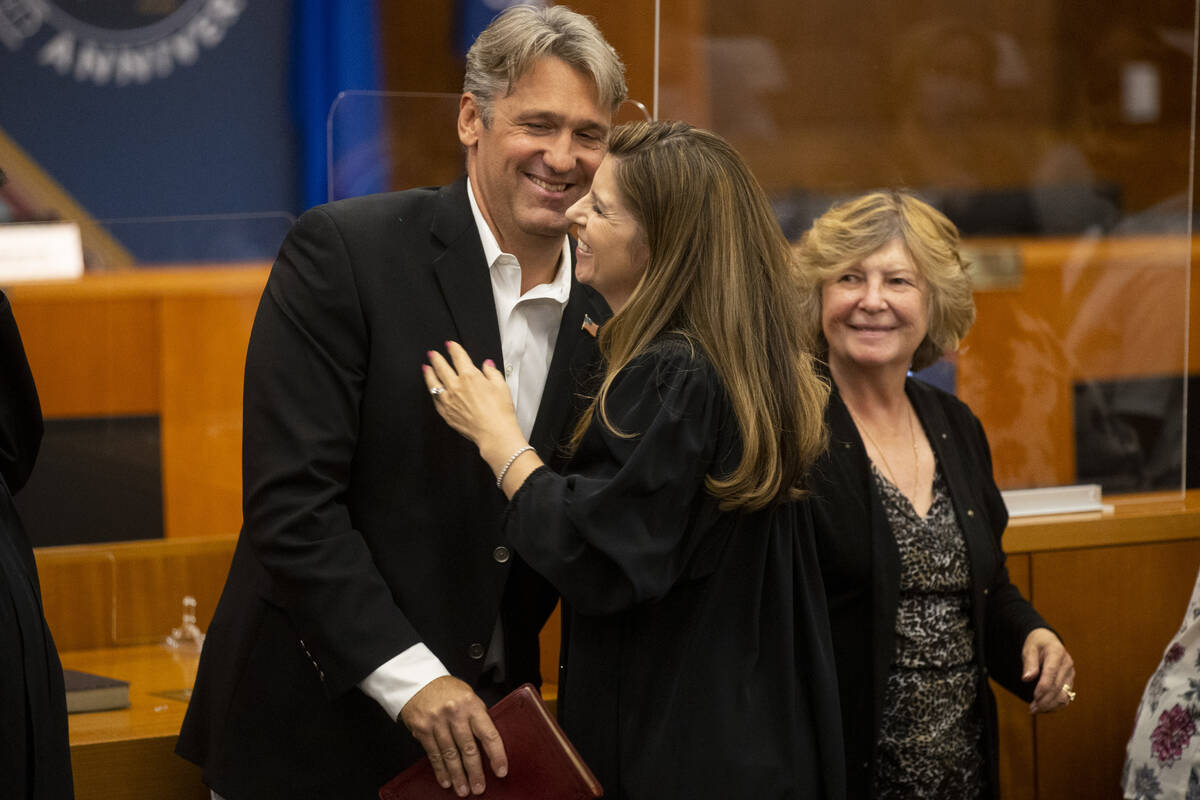 Judge Veronica Barisich embracer her husband Adam during the Eight Judicial District Court inve ...