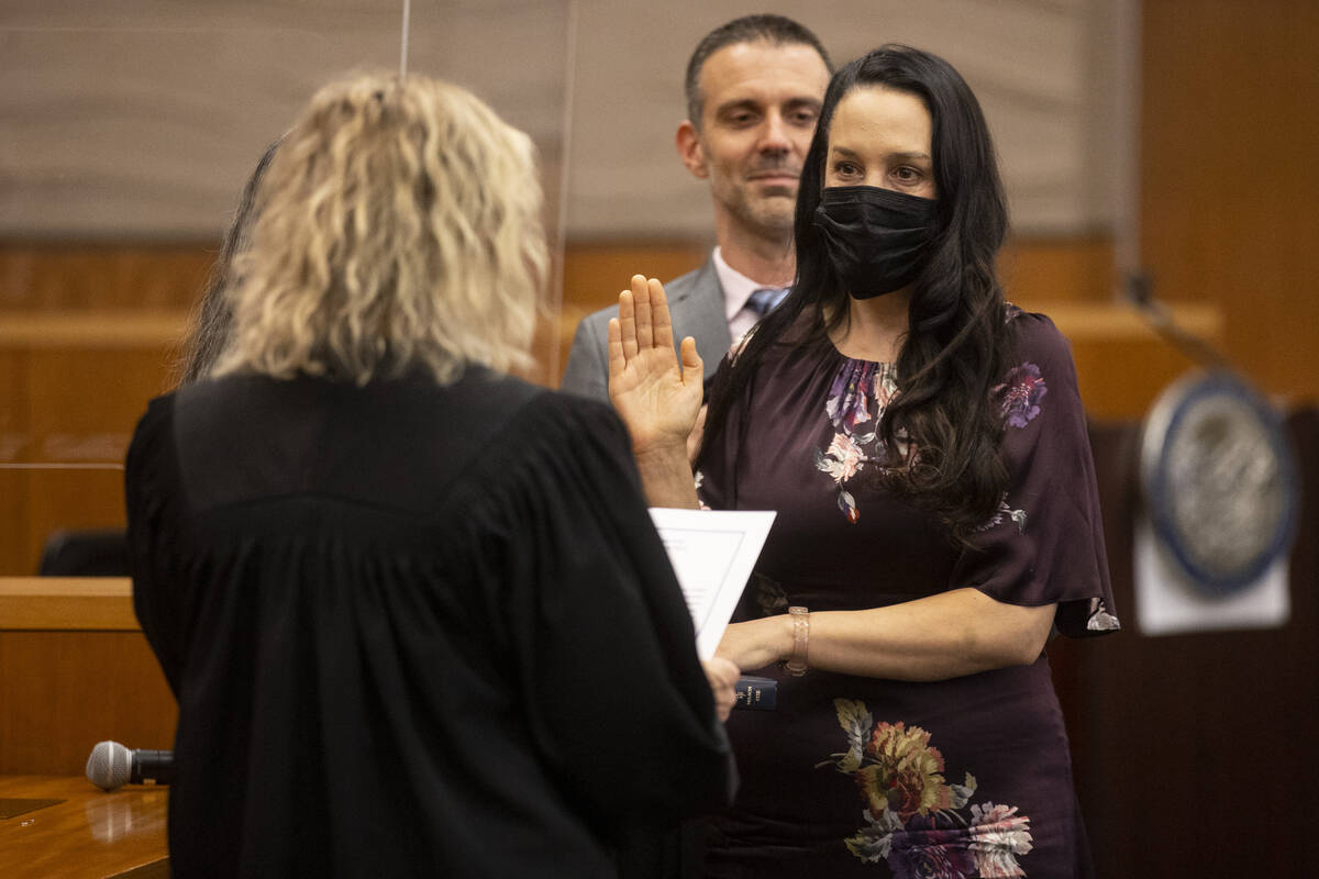 Judge Nadia Krall is sworn in during the Eight Judicial District Court investiture ceremony at ...