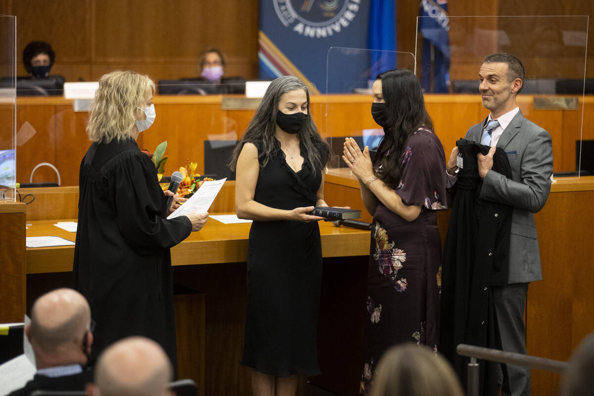 Judge Nadia Krall, third from left, is sworn in by Honorable Linda Marie Bell, during the Eight ...