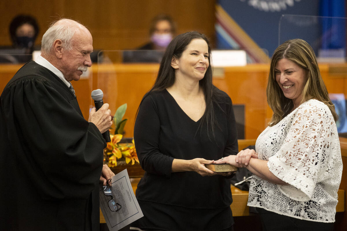 Judge Amy Mastin, right, is sworn in by Honorable Gerald Hardcastle, left, with the assistance ...
