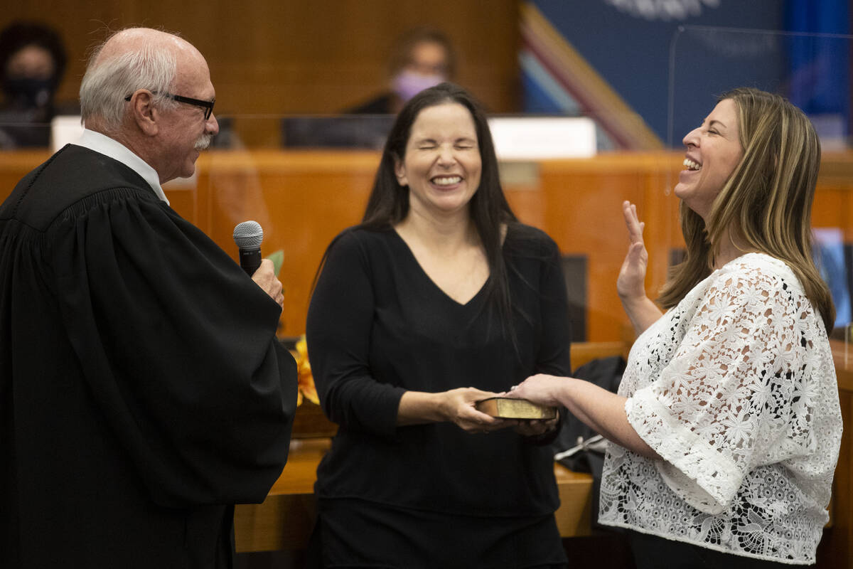 Judge Amy Mastin, right, is sworn in by Honorable Gerald Hardcastle, left, with the assistance ...