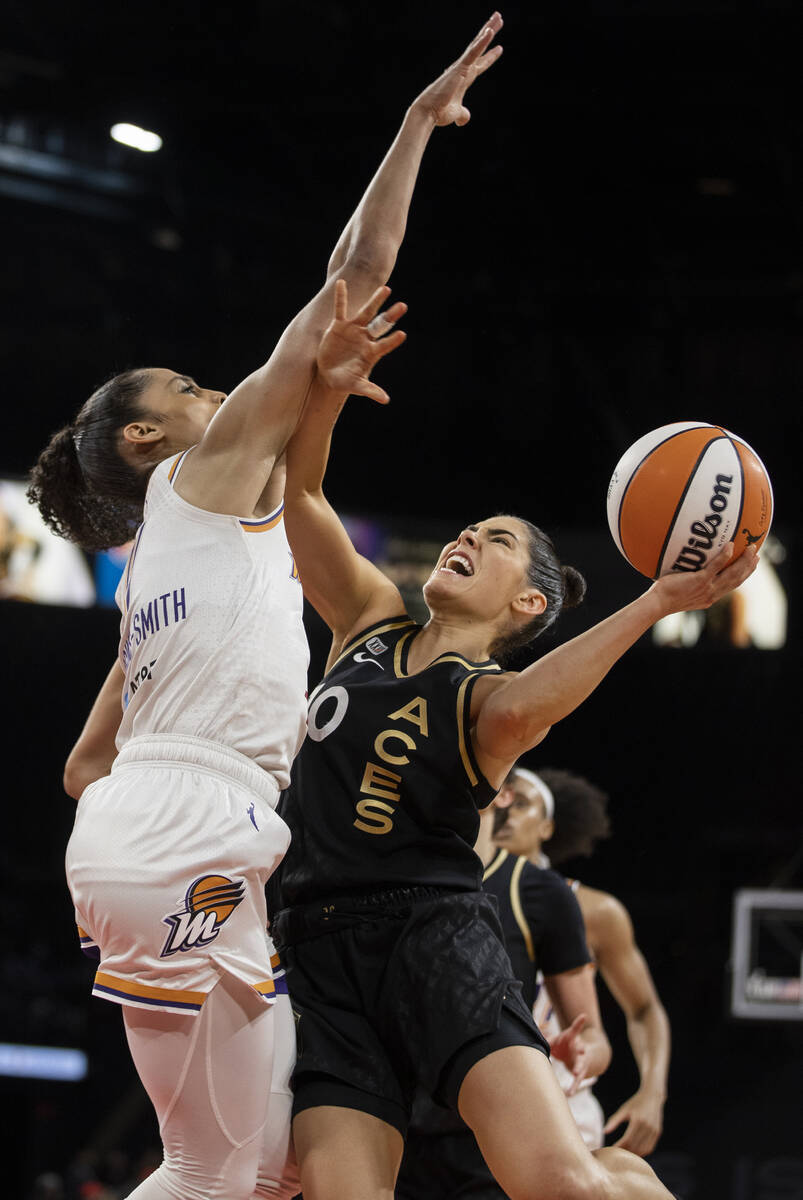 Las Vegas Aces guard Kelsey Plum (10) drives past Phoenix Mercury guard Skylar Diggins-Smith (4 ...