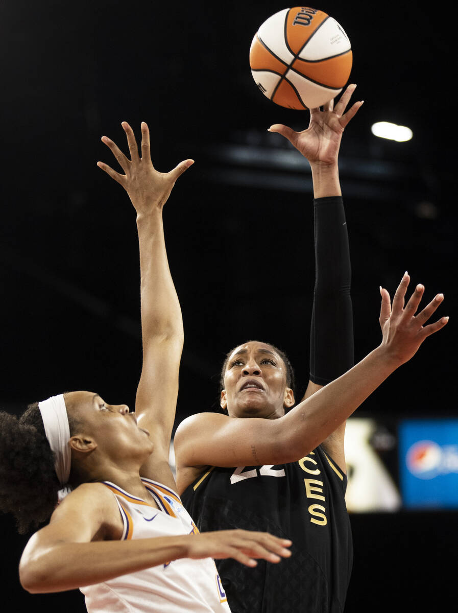 Las Vegas Aces forward A'ja Wilson (22) shoots over Phoenix Mercury forward Brianna Turner (21) ...