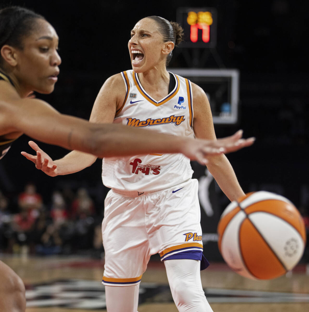 Phoenix Mercury guard Diana Taurasi (3) calls a play with Las Vegas Aces forward A'ja Wilson (2 ...