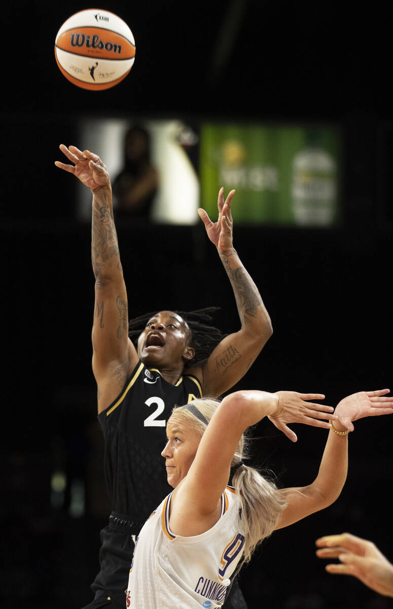 Las Vegas Aces guard Riquna Williams (2) shoots over Phoenix Mercury guard Sophie Cunningham (9 ...