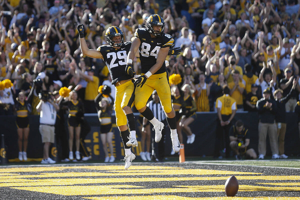 Iowa tight end Sam LaPorta, right, and wide receiver Jackson Ritter celebrate after LaPorta sco ...