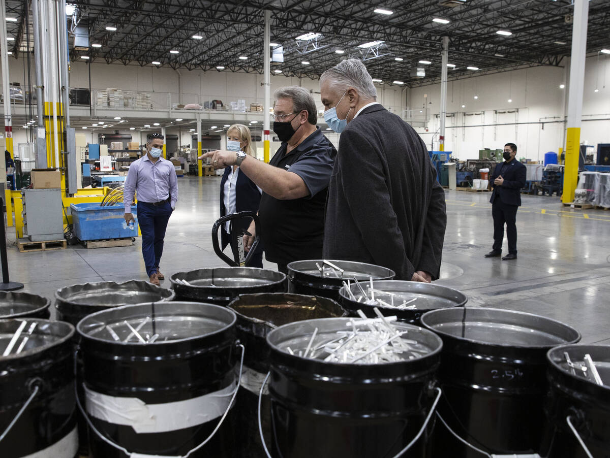 Thomas Power, center, president and CEO of Sunshine Minting Inc., and his wife Patricia Power, ...