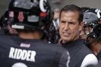 Cincinnati head coach Luke Fickell speaks with quarterback Desmond Ridder (9) prior to an NCAA ...