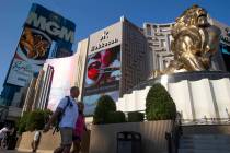 In this Aug. 4, 2021, file photo, visitors to the Las Vegas Strip pass MGM Grand. (Ellen Schmid ...