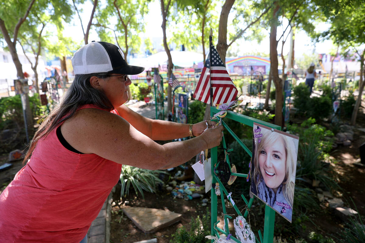 Sue Ann Cornwell hangs a necklace at a dedication for Route 91 Harvest festival shooting victim ...