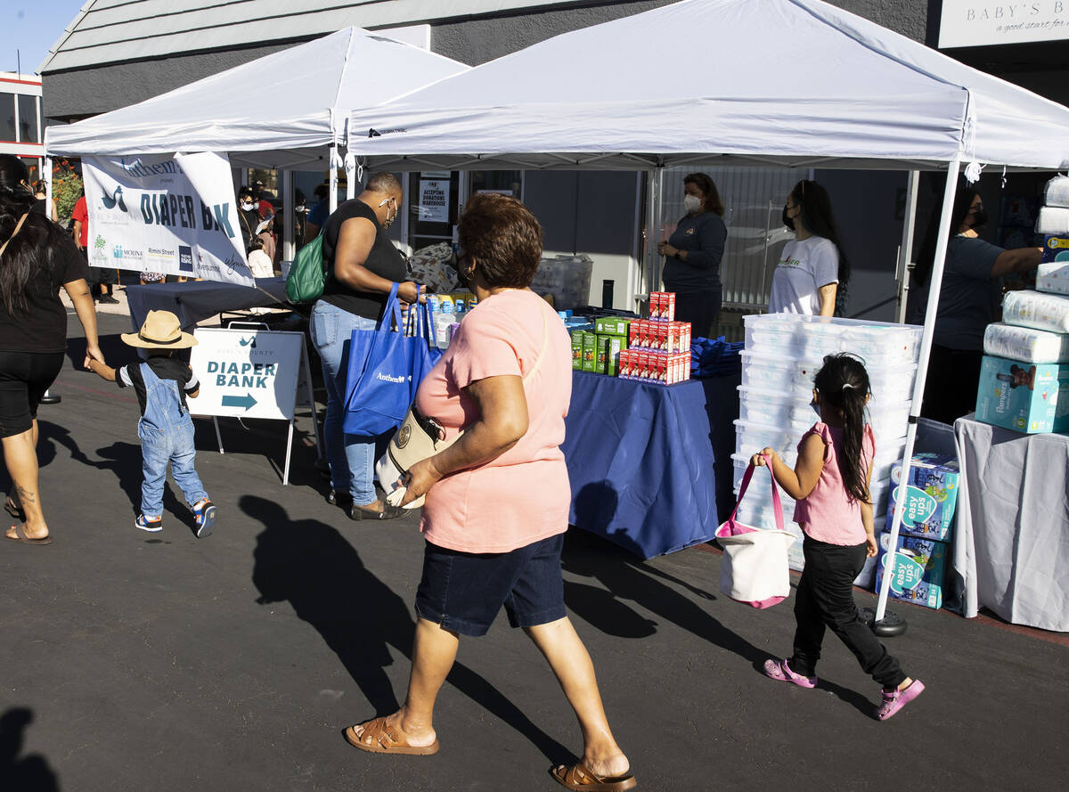 Clients arrive at a pop-up diaper bank event, on Thursday, Sept. 30, 2021, in Las Vegas. Nonpro ...