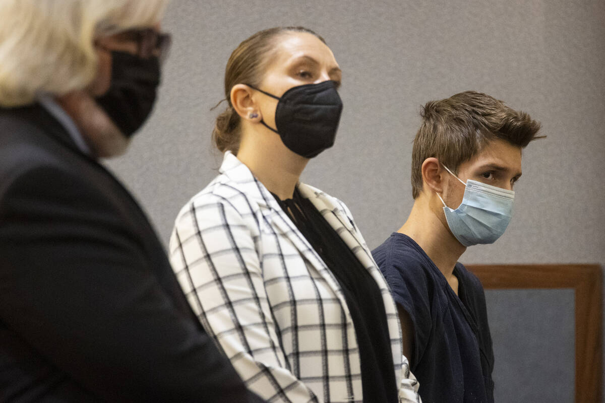 Ethan Goin, far right, a 16-year-old murder suspect, standing beside his attorney, Deputy Publi ...
