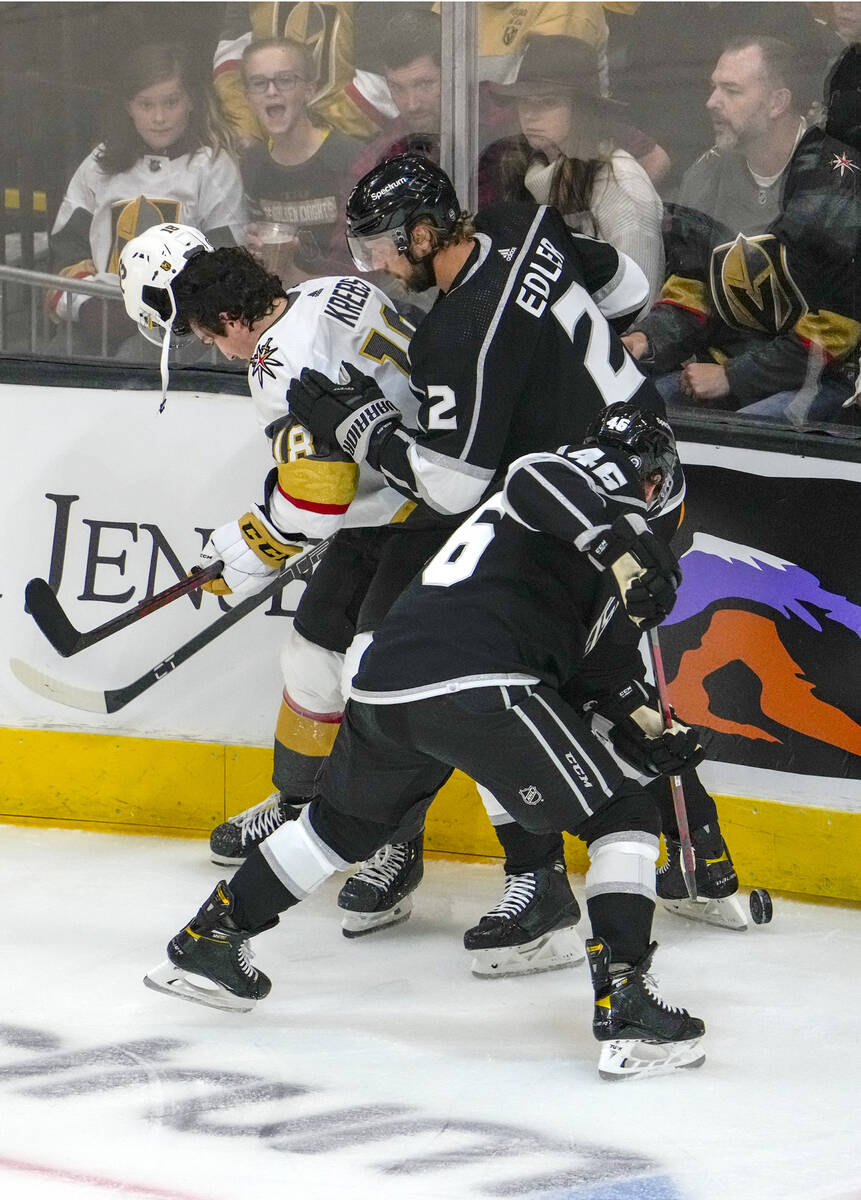 egas Golden Knights left wing Peyton Krebs (18) loses his helmet battling Los Angeles Kings def ...
