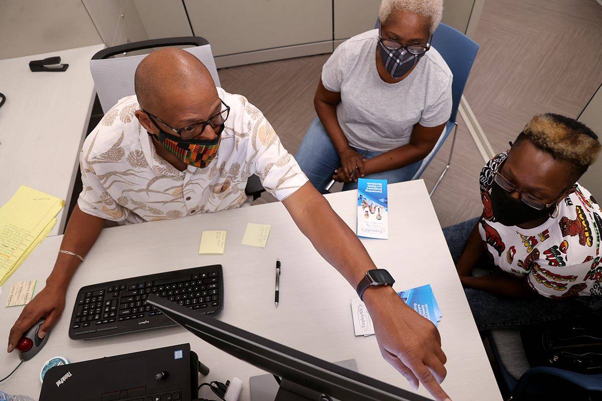 Facilitator Michael Wilson talks to Tonia Boyd, 33, right, and Linda Washington, 60, both of La ...
