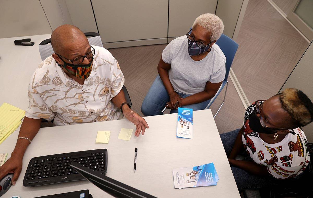 Facilitator Michael Wilson talks to Tonia Boyd, 33, right, and Linda Washington, 60, both of La ...