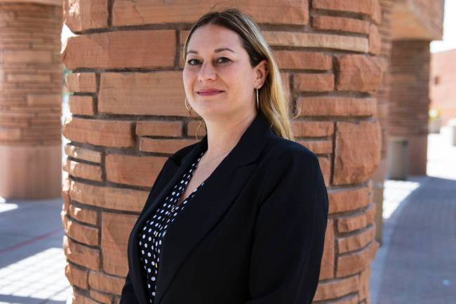 Melanie Rouse poses for a photo outside of the Clark County Government Center building after be ...