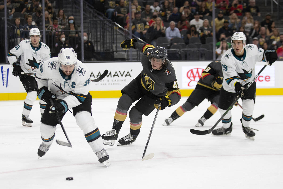 Sharks center Logan Couture (39) and Golden Knights forward Nolan Patrick (41) skate for the pu ...