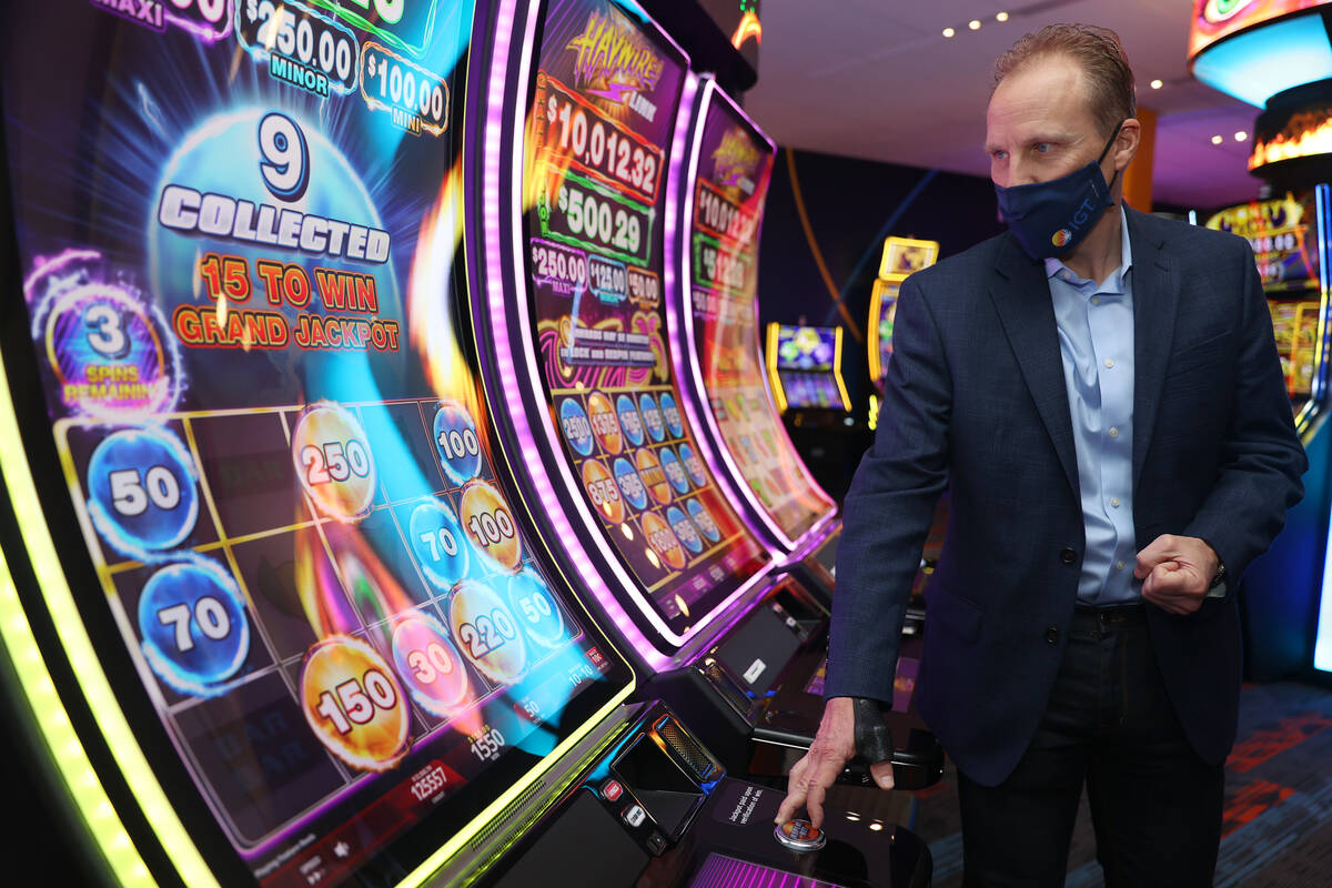 Sr. Director Core Product Roger Pettersson, gives a tour of new gaming technology at the IGT he ...