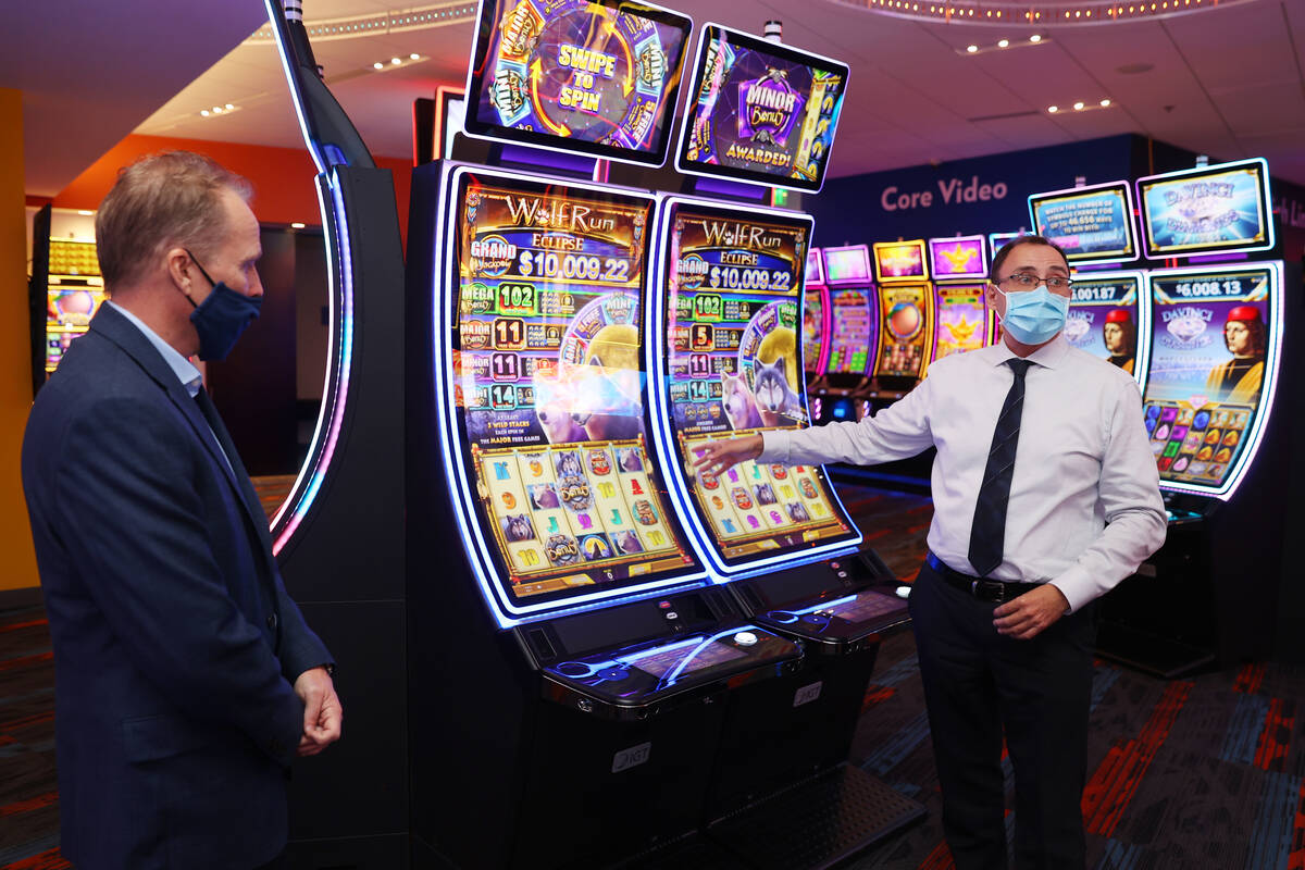 Chief Operating Officer of Gaming for IGT Nick Khin, right, with Sr. Director Core Product Roge ...