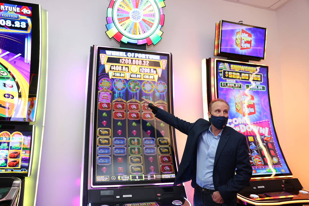 Sr. Director Core Product Roger Pettersson, gives a tour of new gaming technology at the IGT he ...