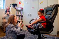 Client Hannah Beal, 4, and Julie Cole, a speech-language pathologist, engage in play therapy at ...