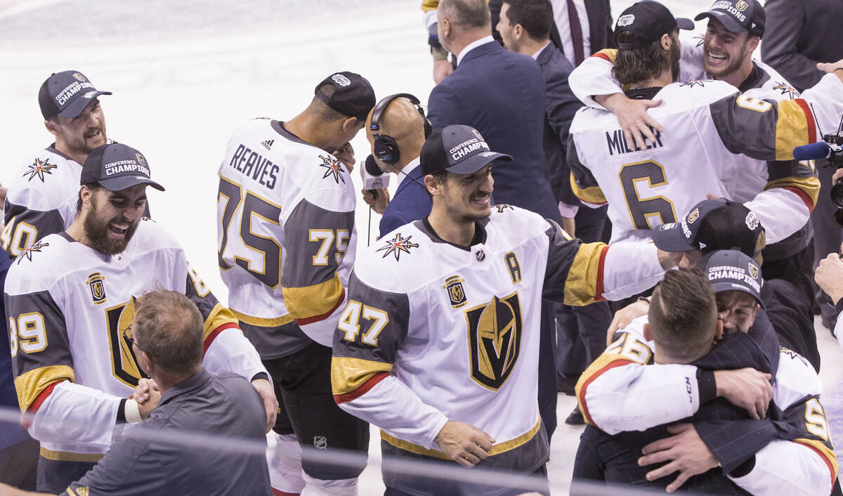 Golden Knights players and staff celebrate after beating the Winnipeg Jets 2-1 to advance to th ...