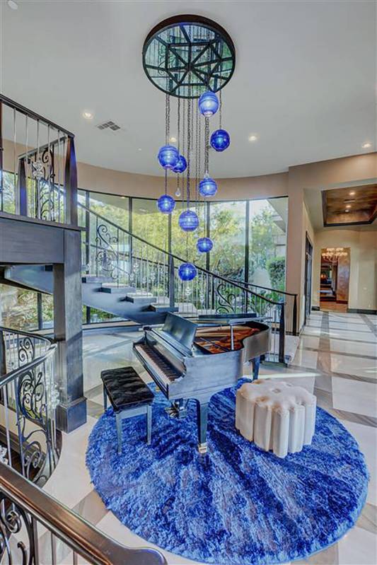 The mansion at 677 Boulder Summit in MacDonald Highlands in Henderson is on the market for $18 ...