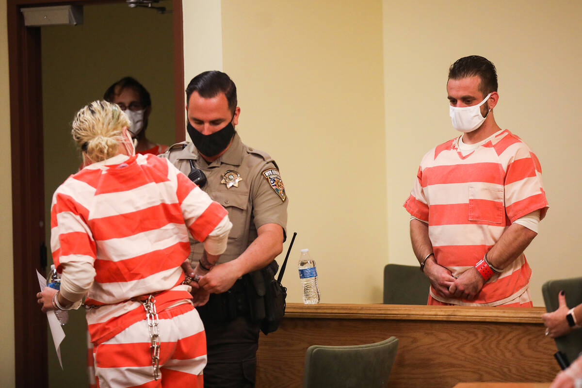 Heather Pate, left, and Kevin Dent, right, get ready to be led out of the courtroom after a pre ...